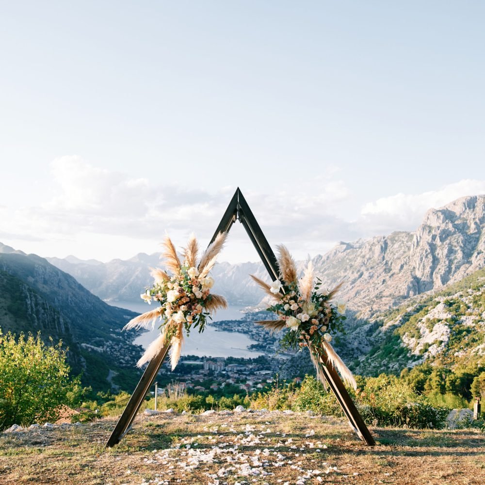 Wedding teepee arch stands on the mountain above the Kotor Bay valley. Montenegro. High quality photo